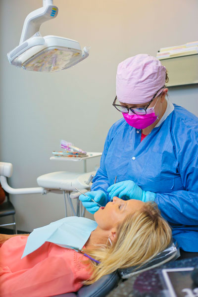 Patient getting a dental exam at Singing River Dentistry in Muscle Shoals, AL