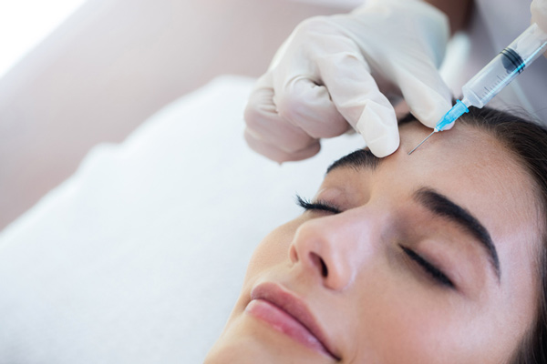 A woman receiving Botox injections from Singing River Dentistry in Florence, AL