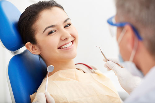 Woman in dental chair smiling